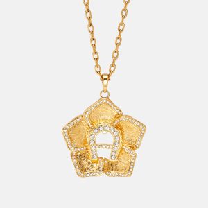 Aigner Gold Tone Crystal Logo Flower Pendant Necklace, Jewelry - Luxury Closet catalog